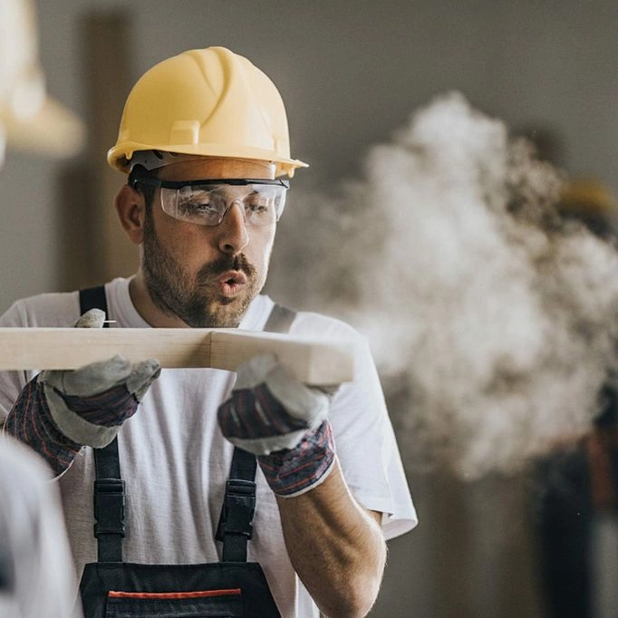 Photo of someone wearing safety glasses for protection against dust