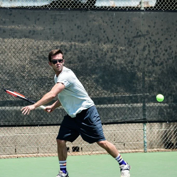 Photo of someone wearing safety glasses while playing pickleball