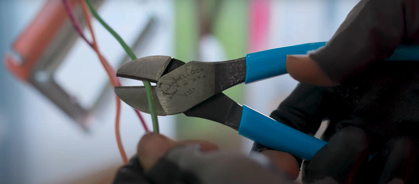 picture of a man using a plier