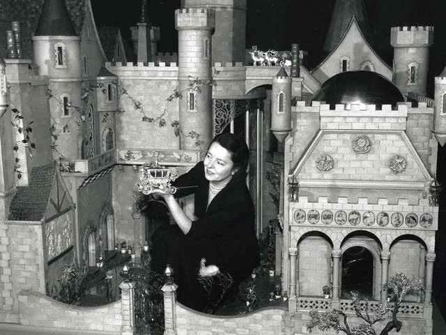 Colleen Moore in her fairy castle work of art with craftsman hand tools