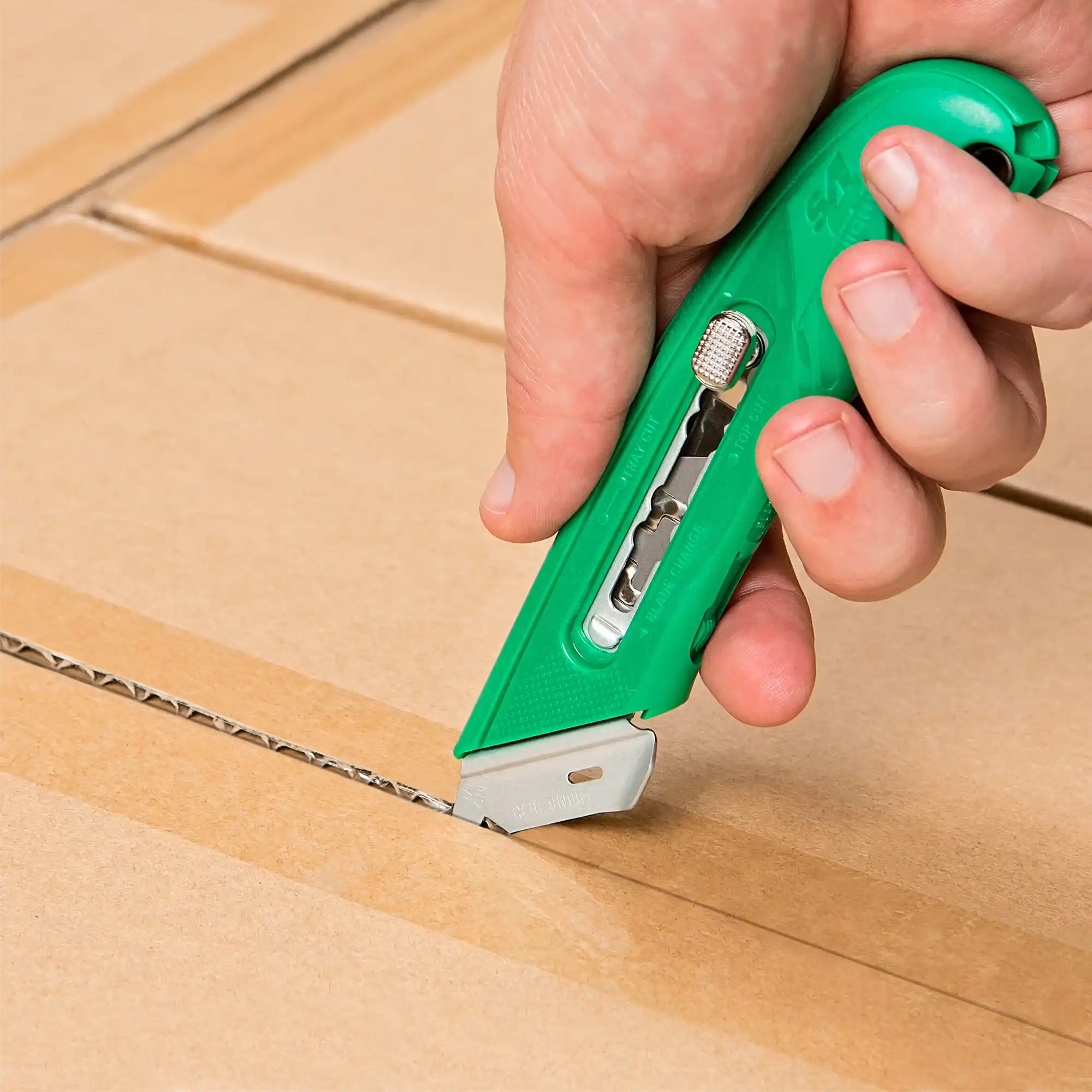 picture of a person using a Pacific Handy Cutter Utility Knife