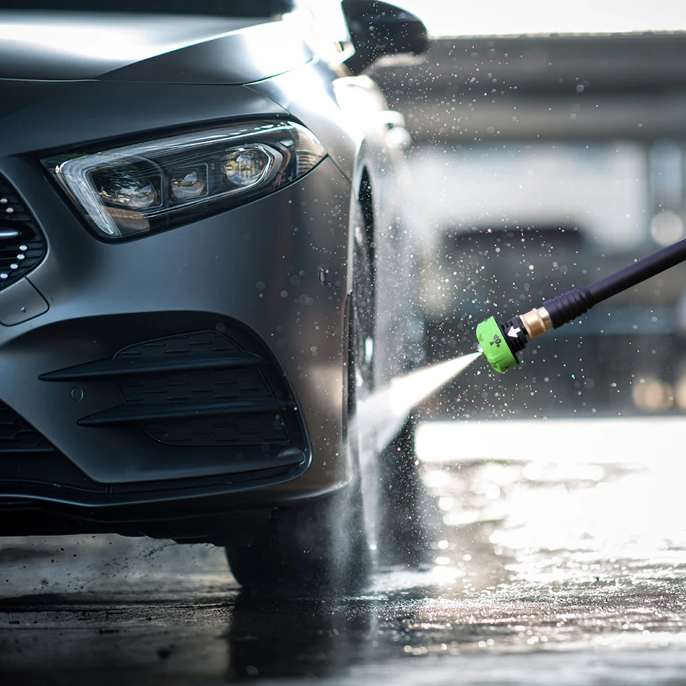 picture of a person using the Greenworks pressure washer for washing a car