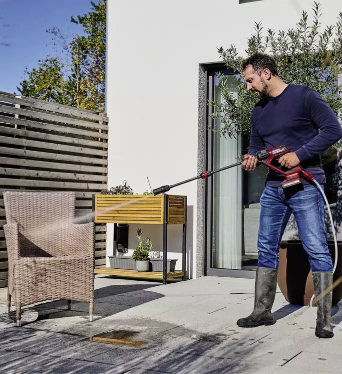 picture of a person using an Einhell pressure washer