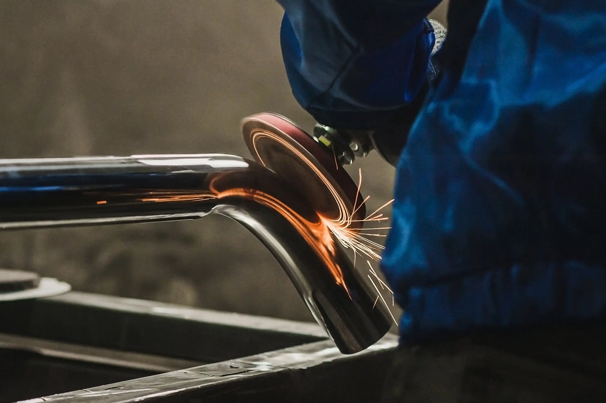 rotary tool being used on metal using a top grinding wheel