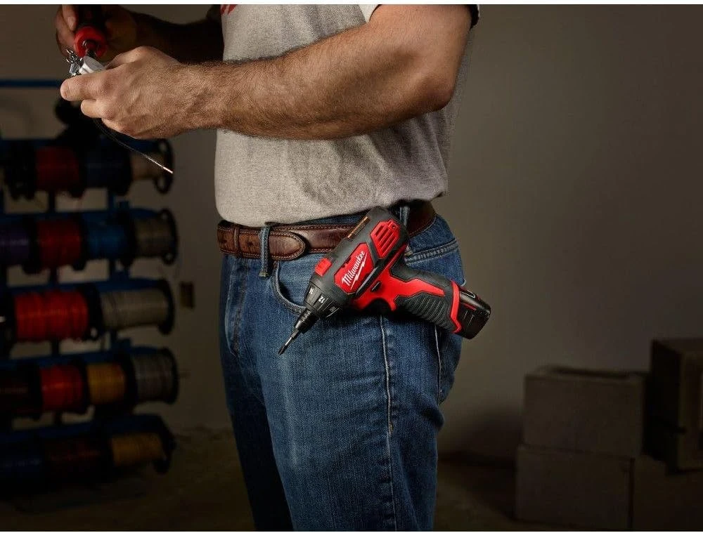 Man with a red Milwaukee electric screwdriver on his belt