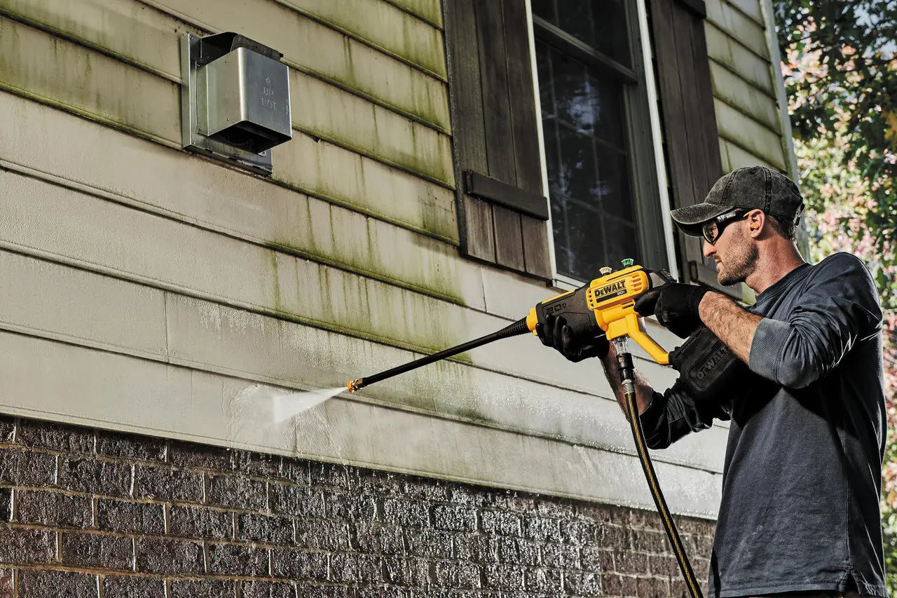 picture of a person using Dewalt cordless pressure washer