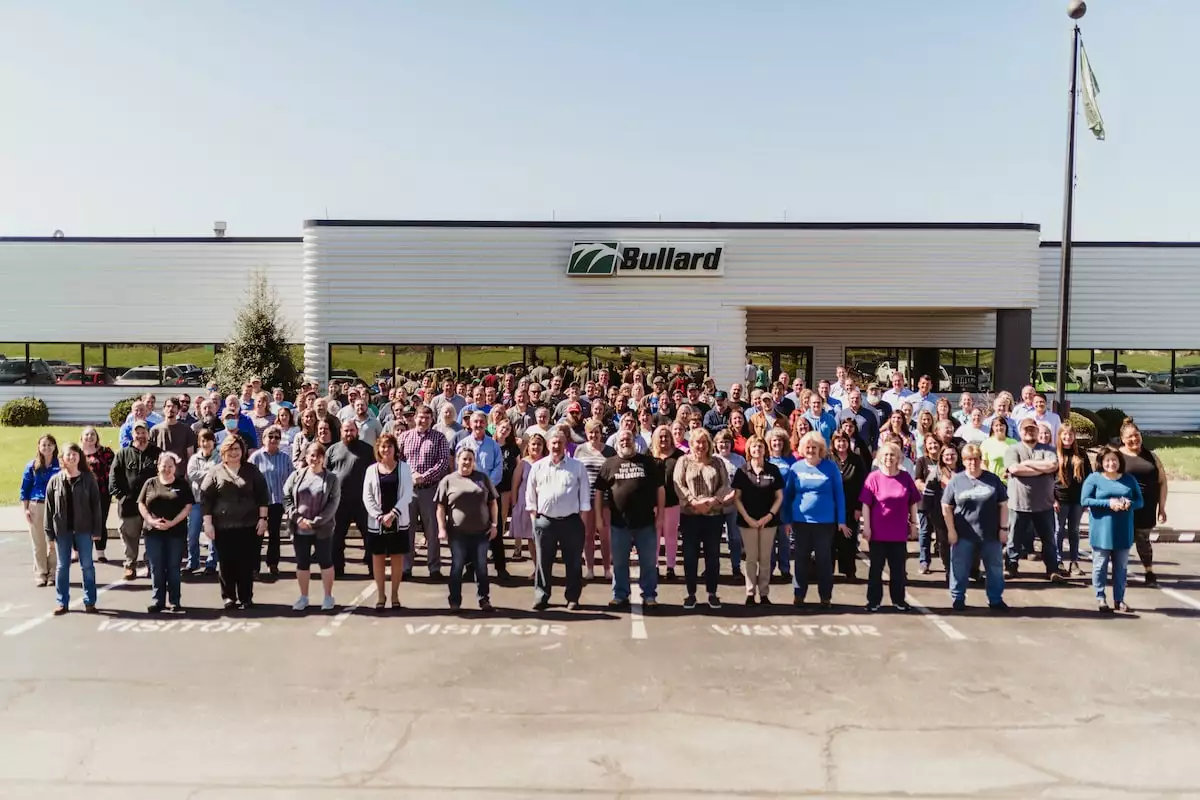 A photo of the Bullard staff standing in front of its office building