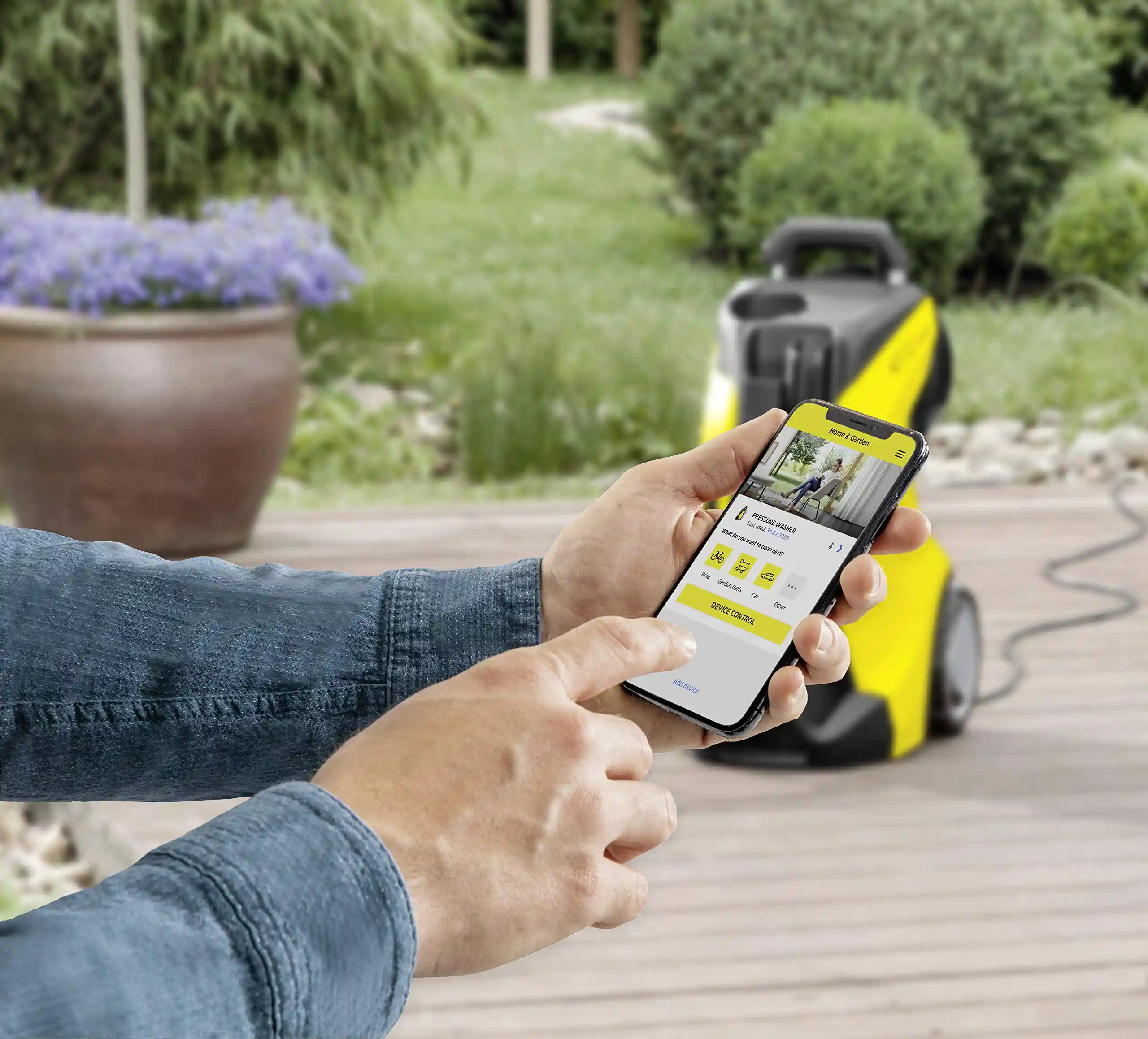 picture of a person using the Kärcher K7 pressure washer