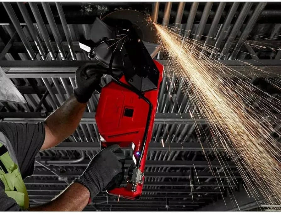 picture of a person using the Milwaukee chop saw