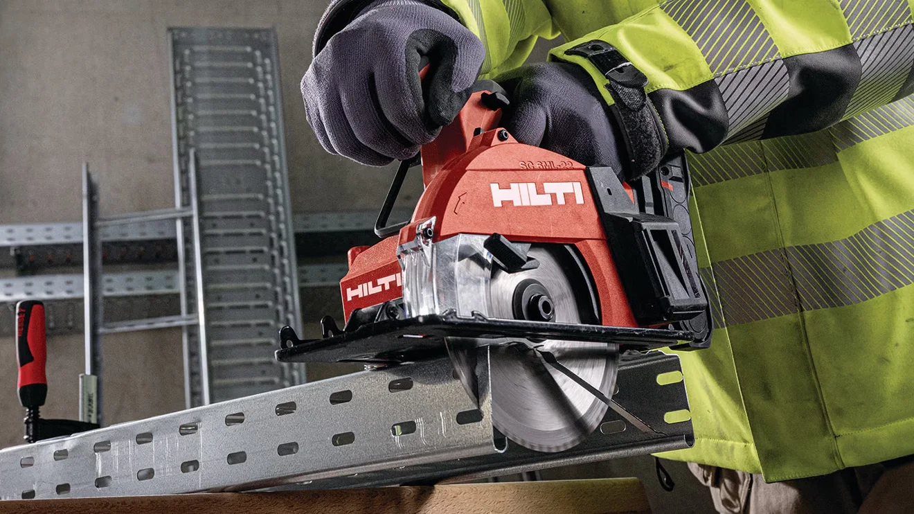 An operator making cuts on wood with a Hilti cordless circular saw