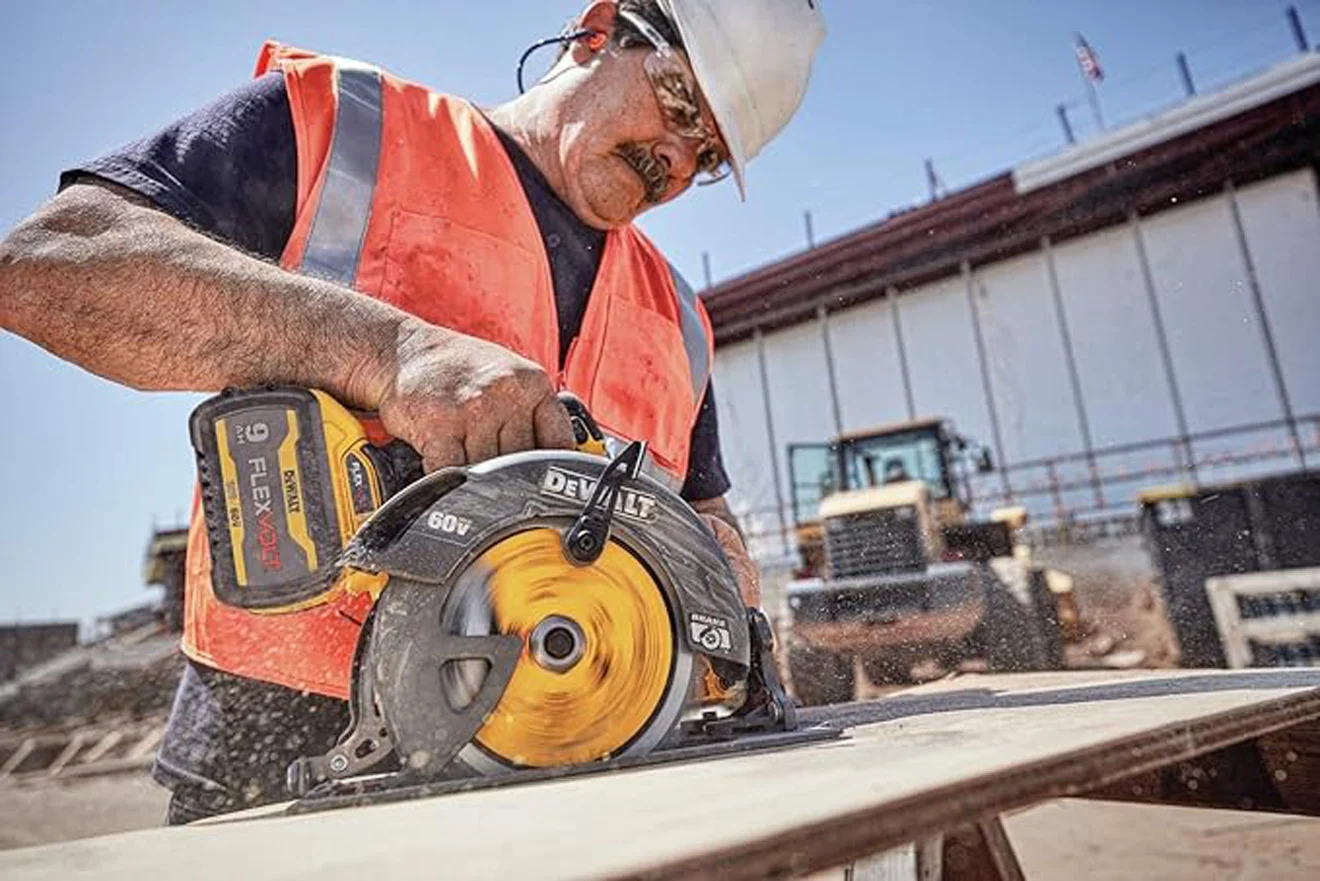 A photo of an operator cutting wood with the DeWalt cordless circular saw