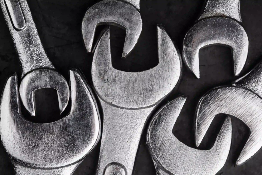 A close-up of wrenches arranged closely together.