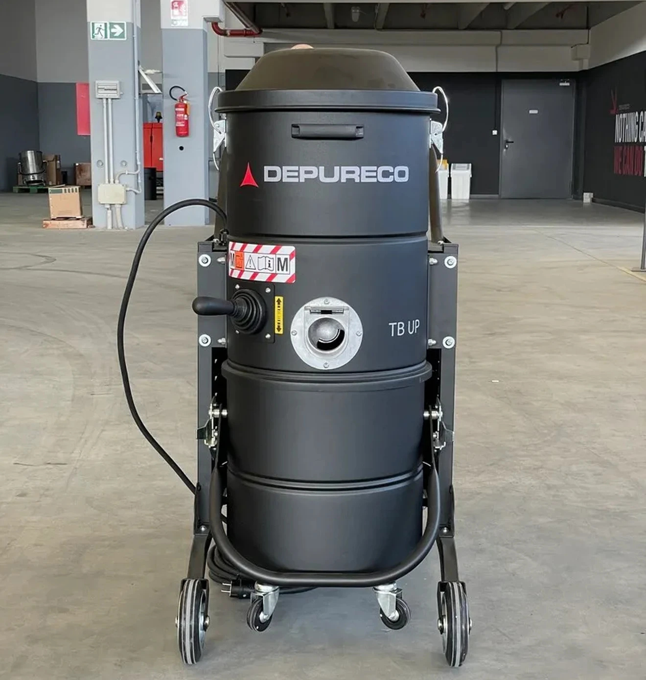 A photo of the Depureco Industrial heavy-duty vacuum cleaner in a workshop