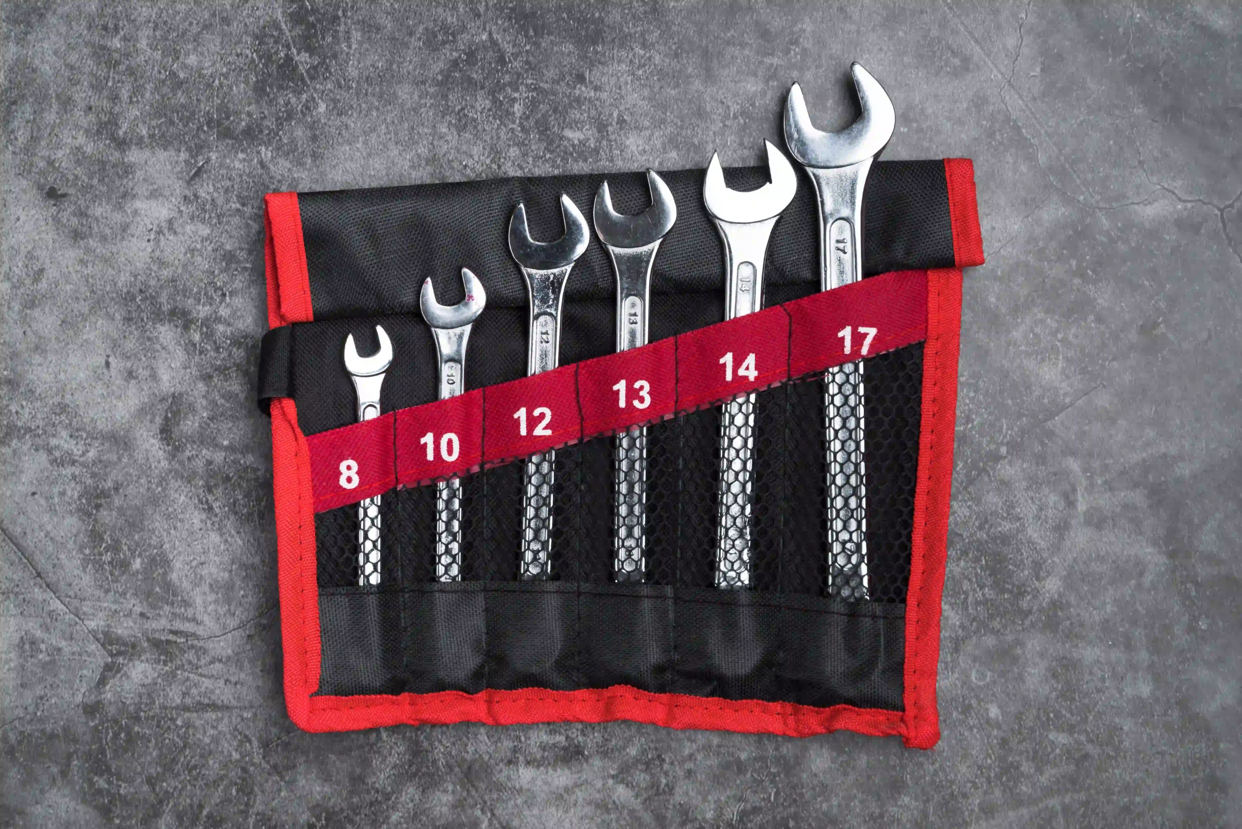 Compact wrench set in a roll-up pouch.