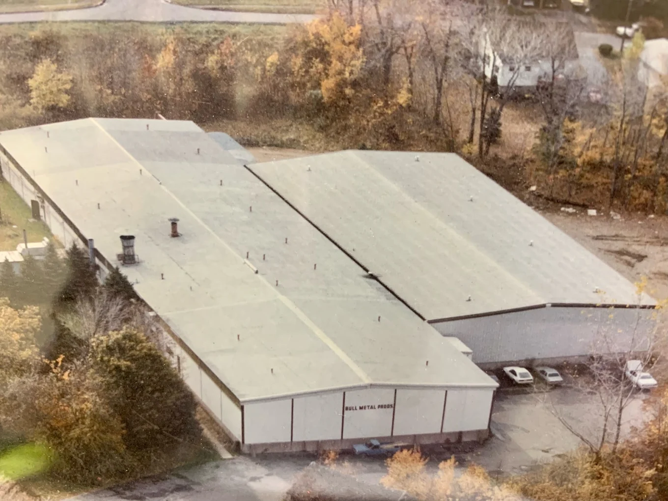 A view of Bull Metal Products industrial facility surrounded by trees.