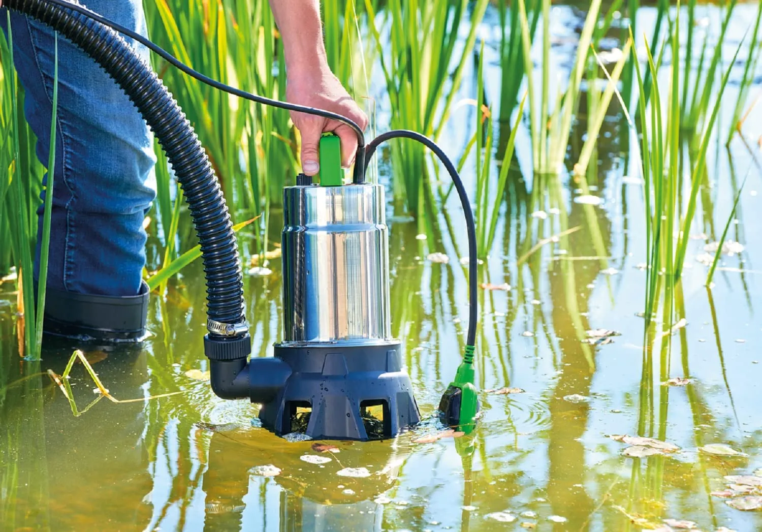 picture of a man using a submersible pump