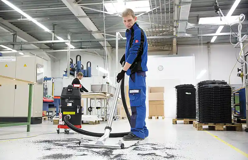 picture of a person using Ruwac industrial vacuum cleaner