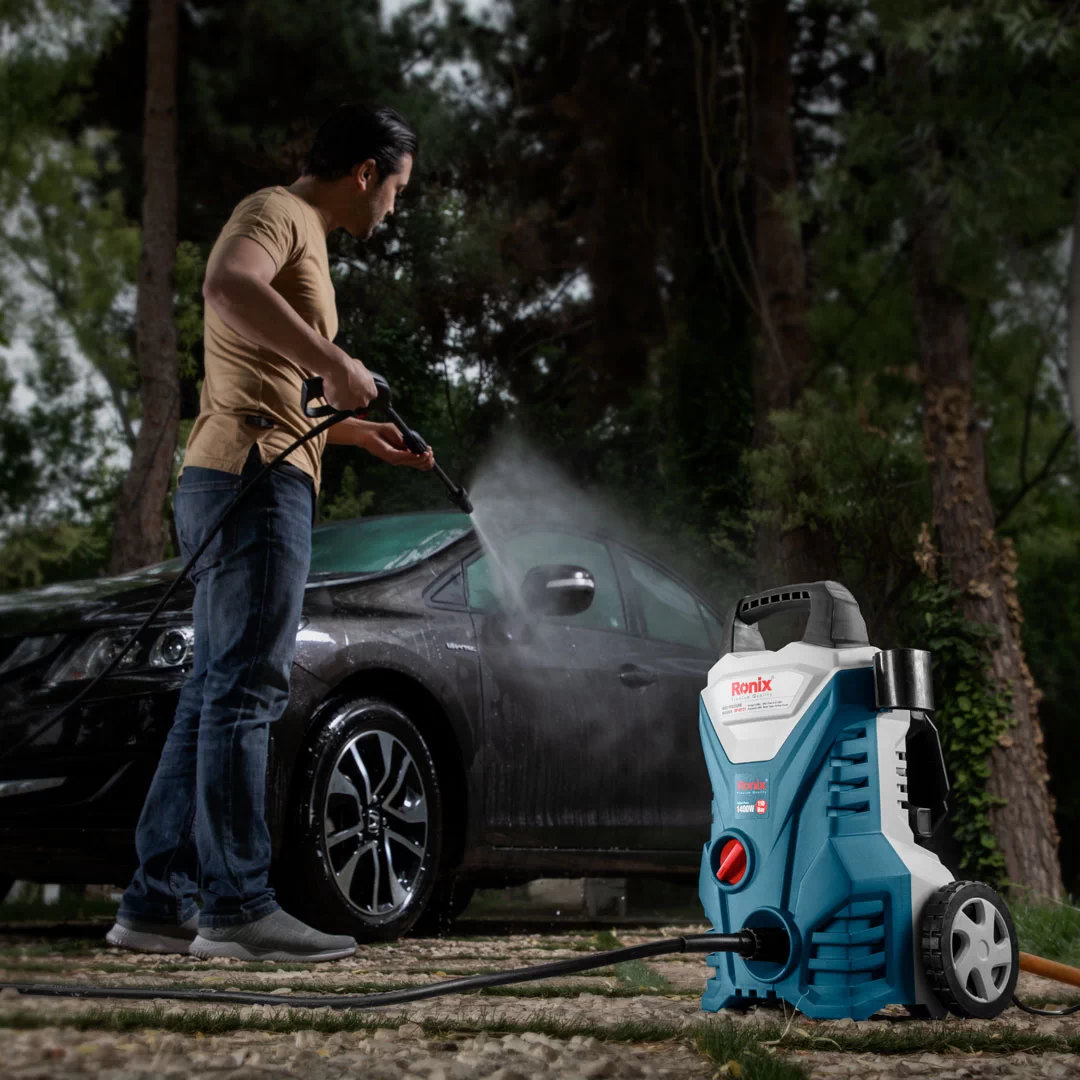 picture of a person using an Electric Pressure Washer for Cars