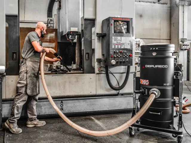 picture of a man using Depureco Industrial Vacuums