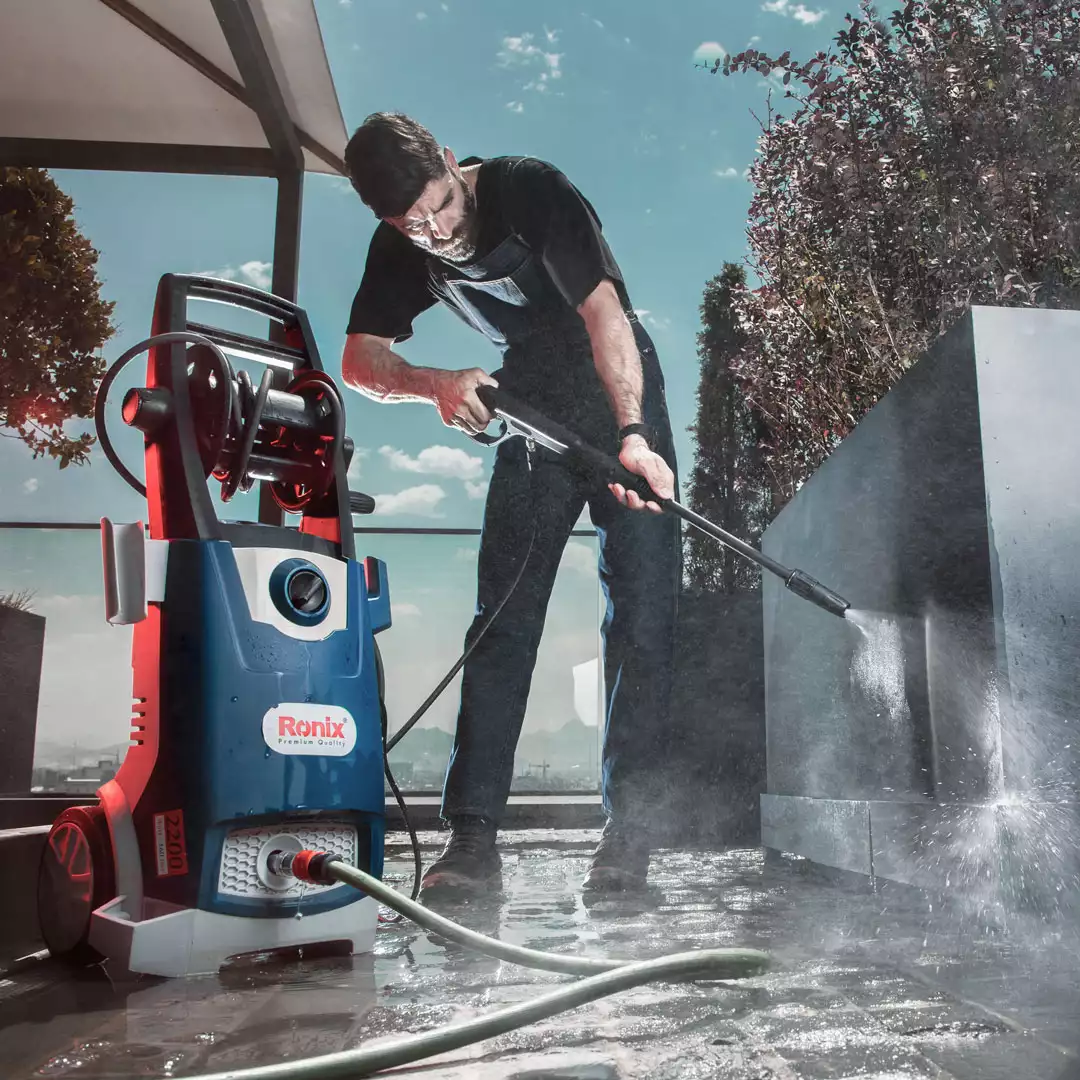 A Man Using Ronix Pressure Washer