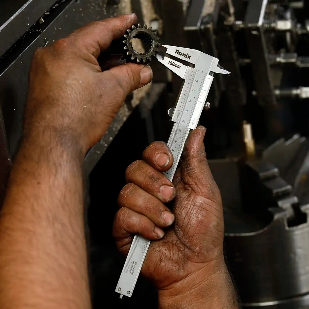 Picture of a person using a Ronix caliper