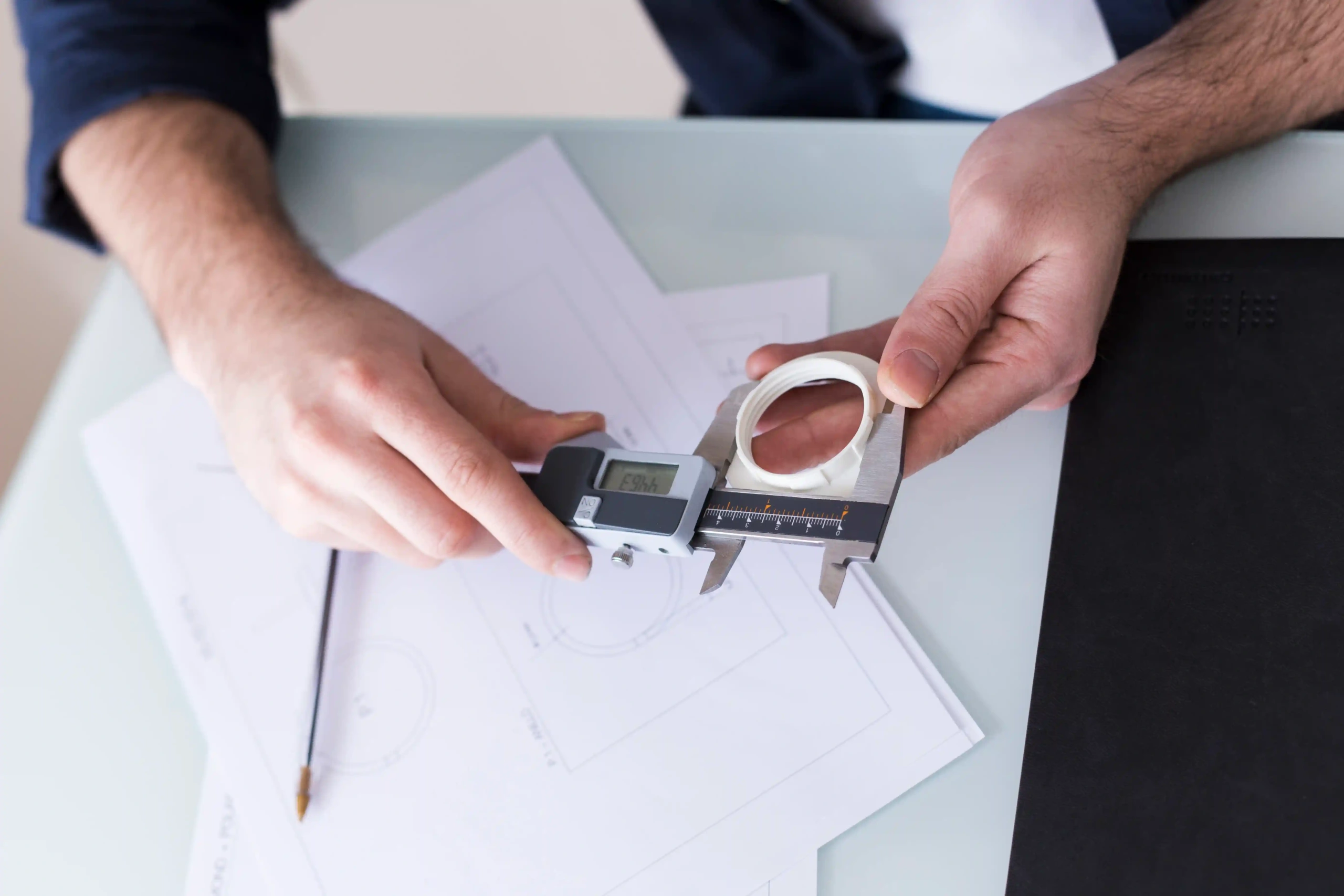 Picture of a person using a digital caliper