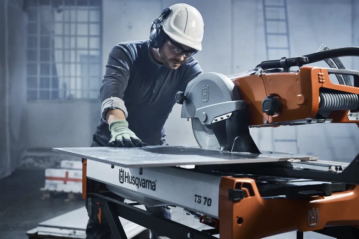 picture of a man using Husqvarna tile saw